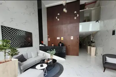 a living room with a couch and a table at Lovely Aparment OceanView Barranco1809 in Lima