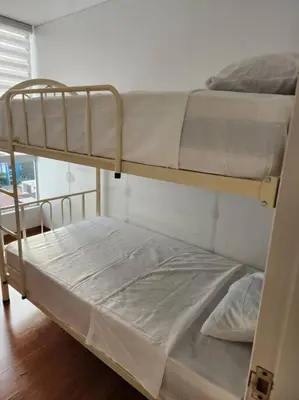 a couple of bunk beds in a room at R&M Apartament in Lima
