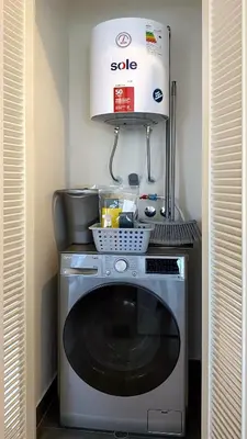 a washing machine in a kitchen with a appliance at The Classic by Wynwood House in Lima