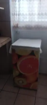 a box full of fruit sitting on the floor at depacentrohuancayo in Huancayo