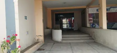 a hallway of a building with stairs and a door at depacentrohuancayo in Huancayo