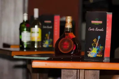 a bottle of wine sitting on top of a table at Lunahuana River Resort in Lunahuaná