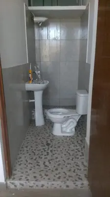 a bathroom with a toilet and a sink at RESIDENCIAL SALAMANCA in Lima