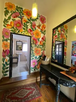 a bathroom with a mirror and a sink at Casona Dorada Hotel Cusco in Cusco