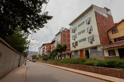 an empty city street with buildings on either side at Dreams Boutique Hotel Cusco in Cusco