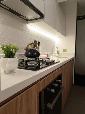 a kitchen with a stove with a pot on it at Runawasi Apartments - Killary Miraflores 2BDR in Lima