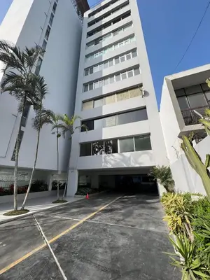 a parking lot in front of a building at Bright 1BR close to boulevard in Lima