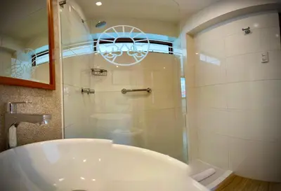 a bathroom with a tub and a glass shower at Inkantari Boutique Hotel in Cusco