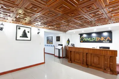 a lobby of a hotel with a wooden ceiling at Hotel Amerinka in Cusco