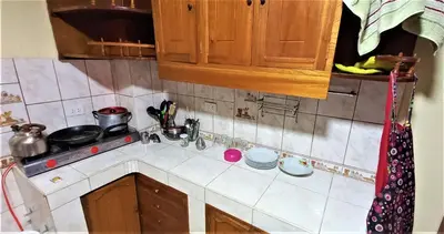 a kitchen with a sink and a counter top at Carlos Guest House 2 Cusco in Cusco