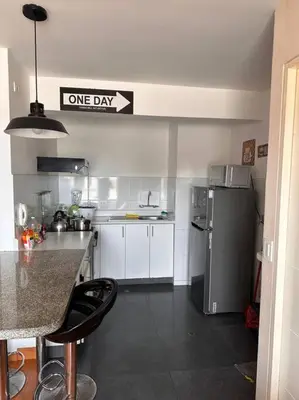a kitchen with a one day sign on the wall at Lindo Departamento en Av. Guardia Civil 861 - Chorrillos in Lima