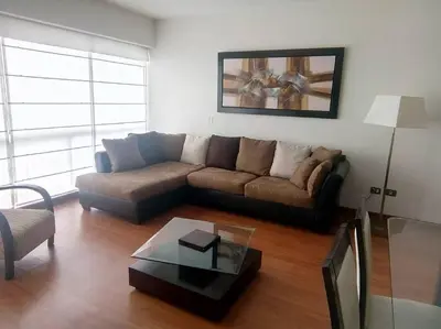 a living room with a couch and a coffee table at New and nice apartment Miraflores in Lima
