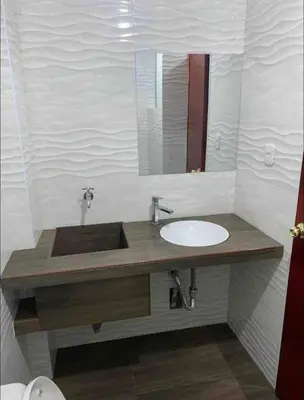 a bathroom with a sink and a mirror at Departamento en el centro histórico en 3er y 4to piso in Ayacucho