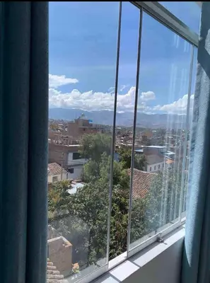 a view of a city from a window at Departamento en el centro histórico en 3er y 4to piso in Ayacucho