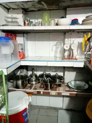 a kitchen with pots and pans on a stove at Posada Ternura in Lima