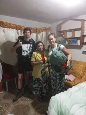 a group of three people standing in a room at Posada Ternura in Lima