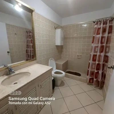 a bathroom with a sink and a toilet and a mirror at APARTAMENTO 502 in Lima