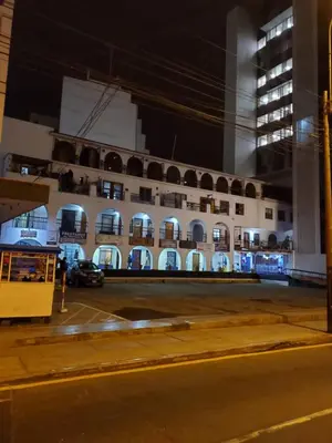 a building with a parking lot in front of it at Centric, private, petfriendly budget apartments in Miraflores in Lima