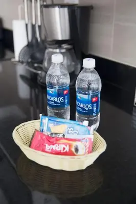 two bottles of water in a basket on a table at Barranco Perfect Location - Apartament in Lima