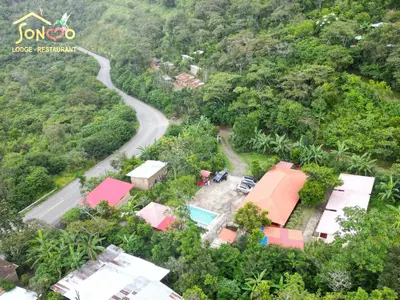 an aerial view of a house and a road at SONCCO LODGE-RESTAURANT in Quillabamba