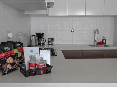 a kitchen with a counter top with food items on it at Cozy 2BR Loft in the Heart of Miraflores in Lima