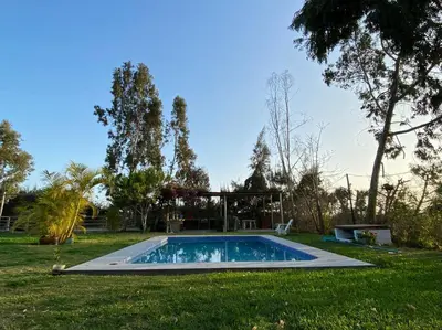 a swimming pool in the middle of a yard at Casa de campo con piscina en Asia in Asia