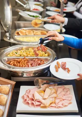 a buffet line with many different types of food at LimaQ Hotel in Lima