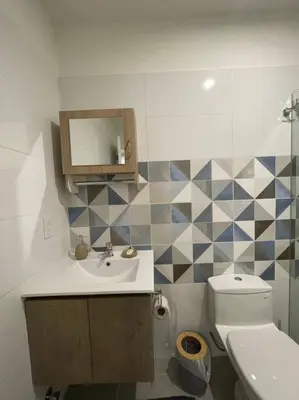 a bathroom with a sink and a toilet at Beautiful loft at heart of Lima in Lima
