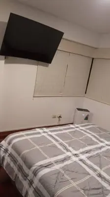 a bed in a room with a ceiling at A beautiful place in the heart of Miraflores in Lima