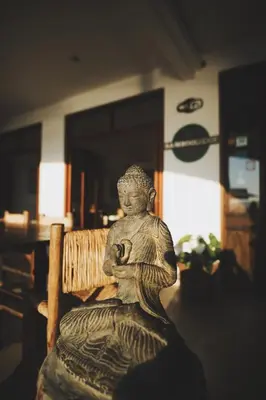 a statue sitting on top of a bench at Bamboo Lodge Paracas in Paracas