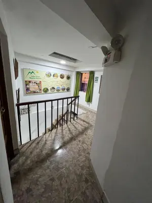 a view of a hallway with a stairway in a house at Euro Hostal in Cusco