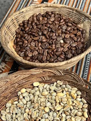 two baskets full of coffee beans on a table at Refugio de Mery Lucmabamba in Sahuayacu