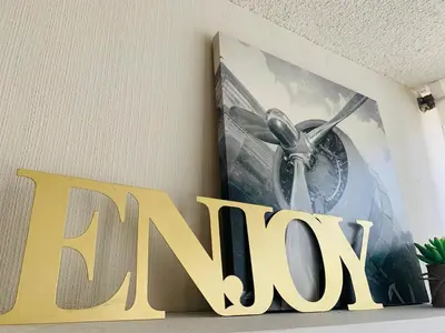 a picture of a airplane on a wall with a sign at 807. Departamento entero en Chorrillos in Lima