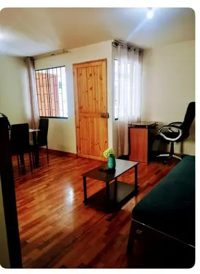 a living room with a couch and a table at Miraflores Moonlight in Lima