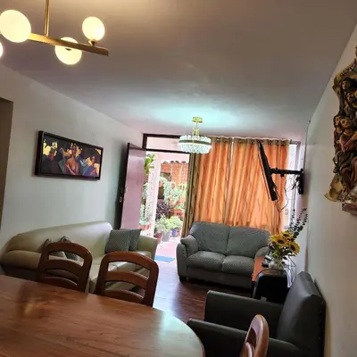 a living room with a table and chairs at Casa Cultura II in Lima