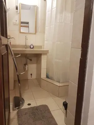 a bathroom with a sink and a shower at Nico Homes in Cusco