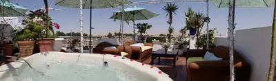 a bath tub sitting on top of a patio at Ollanta Rooftop Adults only in Ica