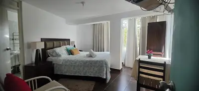 a bedroom with a bed and a window at Ollanta Rooftop Adults only in Ica