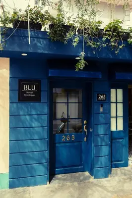 a blue building with a blue door at Blu Hotel Boutique in Lima