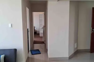 a room with a hallway with a blue mat on the floor at apartamento de estreno con balcón frente al mar. in Lima