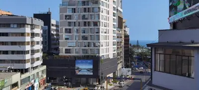 an aerial view of a city with tall buildings at MIRAFLORES CITY HOTEL in Lima