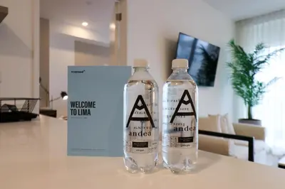 two bottles of water sitting on top of a table at Sky Balta in Miraflores by Wynwood House in Lima
