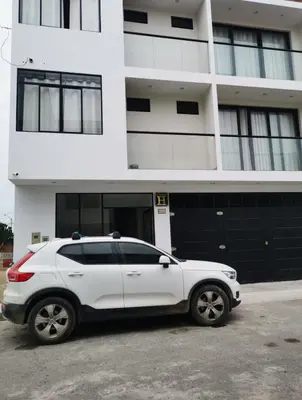 a white car parked in front of a building at Hotel Sol de Marcona in San Juan de Marcona