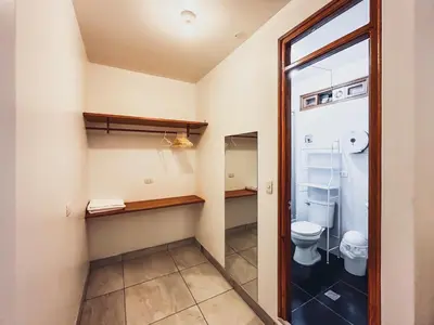 a bathroom with a toilet and a window at Excelente ubicación! Bellas y cómodas habitaciones en el centro de Oxapampa in Oxapampa