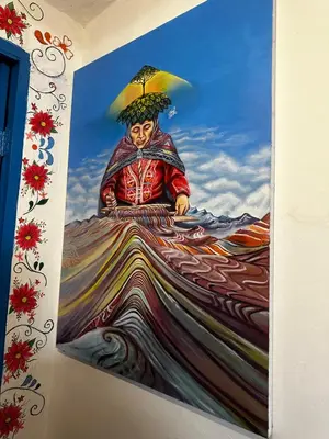 a painting of a person with an umbrella on a wall at AITANA'S HOUSE - SAN BLAs in Cusco