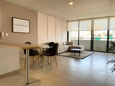 a living room with a couch and a table at Modern Penthouse & 2BR in Miraflores by Wynwood House in Lima