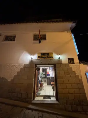 an entrance to a building with a sign on it at Hostal El Auqui in Cusco