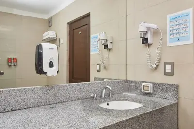 a bathroom counter with a sink and a phone at Casa Andina Standard Machu Picchu in Machu Picchu