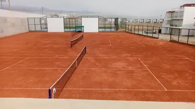 a tennis court on top of a building at Departamento de Playa (con piscina propia) en km 107 Asia, Lima in Asia