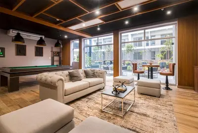 a living room with a couch and a pool table at Departamento de Estreno en Barranco in Lima